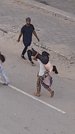 Street life in Khan Yunis — people moving, kids walking