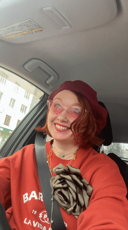Woman in red beret drives through Yekaterinburg