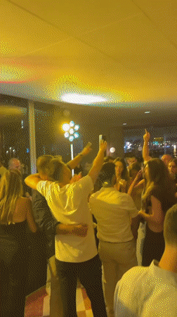 Tel Aviv bar or club buzzing with dancing and colored lights