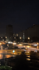 Rainy night cityscape with traffic captured by witness