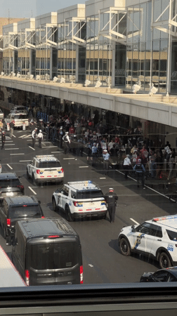 Protest outside modern building in Philadelphia with police presence