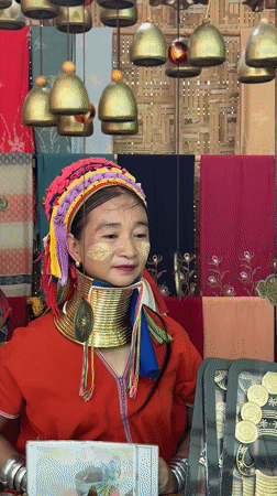 Kayan woman in traditional dress spotted at Thai markets
