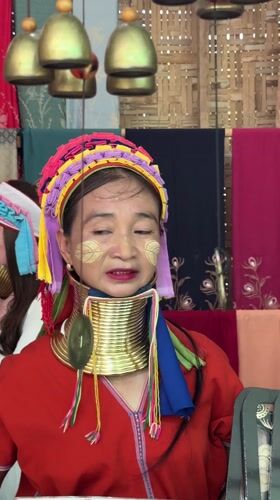 Kayan woman in traditional dress spotted at Thai markets
