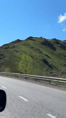 Vehicle captures scenic highway drive through Kazakhstan hills