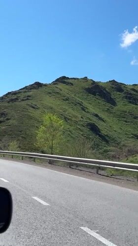 Vehicle captures scenic highway drive through Kazakhstan hills