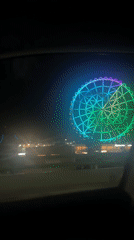 Colorful Ferris wheel lights up Mexico City night sky