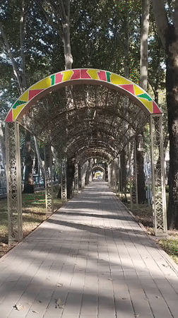 Dushanbe park and ornate civic building, summer afternoon