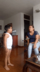Family documents evening moments amid Caracas hillside community