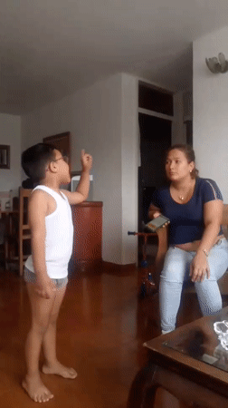 Family documents evening moments amid Caracas hillside community