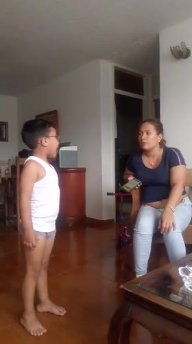 Family documents evening moments amid Caracas hillside community