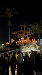 Religious procession with crucifixion statue moves through Benalmádena streets