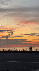 Sunset stroll along a Saint Petersburg waterfront promenade