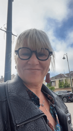 Woman in leather jacket spotted smiling in Montrond-les-Bains