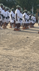 Uniformed men march in formation in Maiduguri, Nigeria