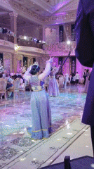 Traditional wedding celebration with costumed dancers in Khujand