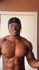 Young man in Kangol beanie observed at doorway