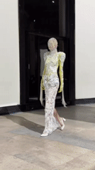 Avant-garde fashion show features masked models in Paris venue