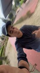 Nighttime jogger films selfie video in Puebla park