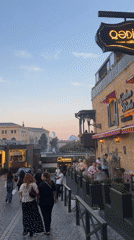 Baku's Sabail district at dusk: cobblestones, bold cars, local color