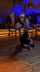 Inverted breakdance freeze on a wooden floor in Burgas