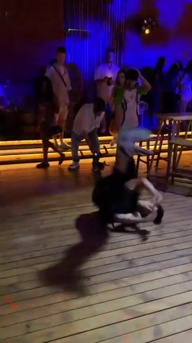 Inverted breakdance freeze on a wooden floor in Burgas