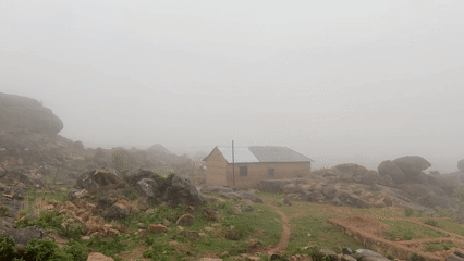 Heavy fog shrouds Jos, Nigeria's rocky landscape Sunday morning