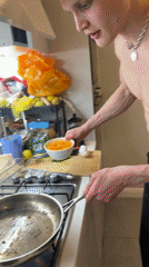 Man cooks eggs shirtless in London kitchen