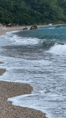 Peaceful morning captured at Montenegro's Prijevor beach with mountains