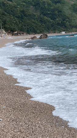 Peaceful morning captured at Montenegro's Prijevor beach with mountains