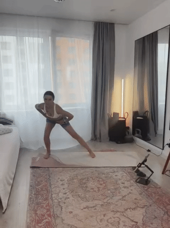Solo workout session on a yoga mat in a Tyumen apartment