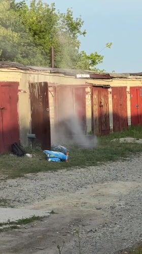 Hazmat suit, open garage, and a grill going in Saratov