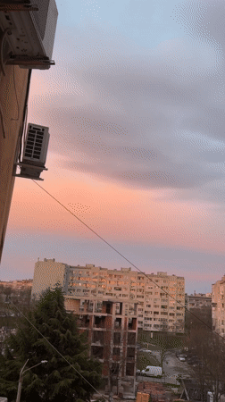 Sunset observed over Burgas cityscape with pink-grey sky