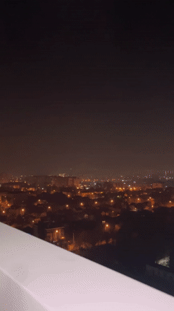 Nighttime cityscape photography session captured from Krasnodar rooftop