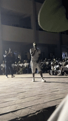 Nighttime musical performance draws audience in Maiduguri courtyard