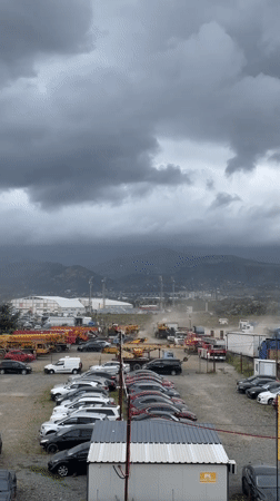 Construction site and parking lot on Tbilisi's outskirts, overcast morning