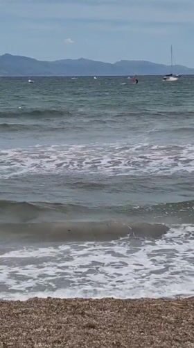 Windy beach day captured in Cagliari, Italy