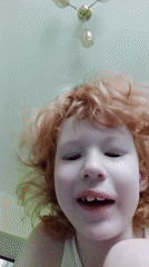Quiet indoor moments with a red-haired child in Blagoveshchensk