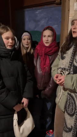 Four women gather in hallway in Yekaterinburg