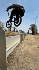 BMX cyclist performs tricks in Sant Adrià de Besòs