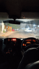 Late-night drive through Duwet, road ahead and dashboard in view