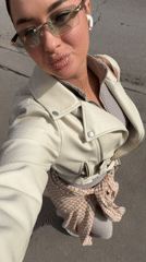 Woman takes multiple selfies in different outfits in Moscow