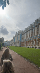 Exploring the grounds of an ornate blue and gold palace