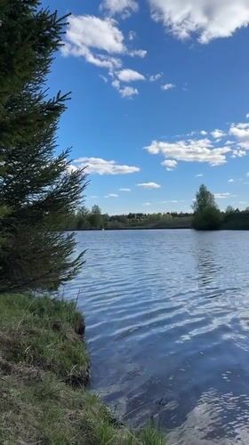 Woman enjoys fishing trip at Russian lake on sunny day