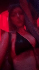 Late-night club scene in Milan, deep into the set.