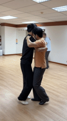 Tango pairs practice in a Bangkok dance studio