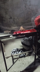 Satay grilling over open coals at a Denpasar street stall