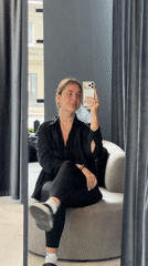 Woman takes masked selfies in Moscow chair