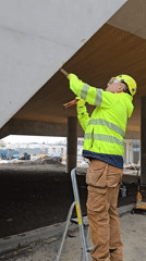 Construction workers grind concrete at Ramat Hasharon worksite