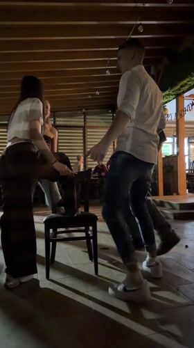Evening social gathering with dancing captured in Velingrad, Bulgaria