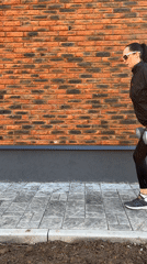 Woman exercises outdoors with dumbbells in Chaikovsky, Russia